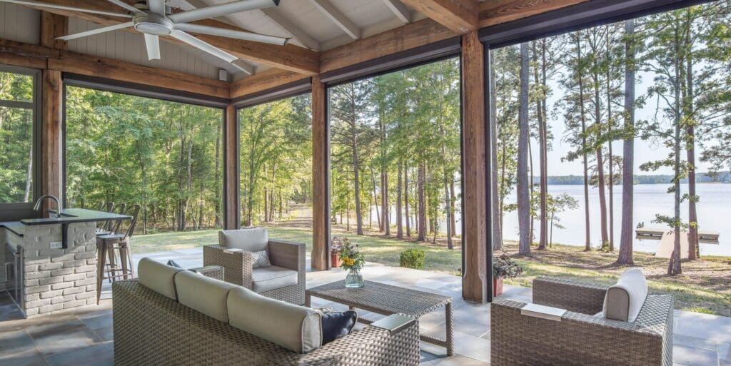 Expand your outdoor space with an interior porch featuring fully deployed Phantom Screens, creating a cozy outdoor living room feel.