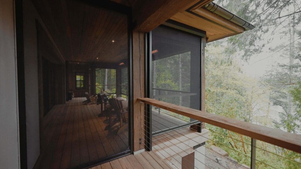 Cozy seating area showcasing screened-in porch ideas with Phantom Retractable Screens deployed in the background.